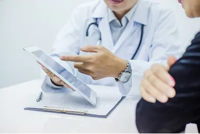 Doctor and patient with tablet