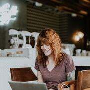 woman using laptop in cafe